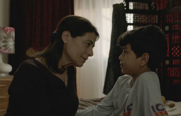 A mother of three tries to protect her family and her houseguests, who are trapped in a Damascus apartment in the 2017 film, 'Insyriated'. [Photo courtesy of Philippe Van Leeuw]