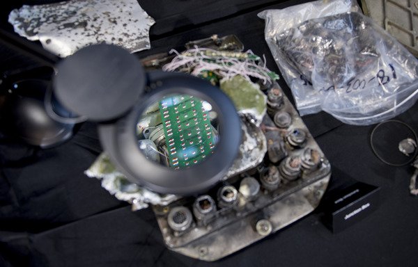 A magnifying glass shows part of the guidance system to an Iranian Qiam Ballistic Missile on display after US Ambassador to the UN Nikki Haley unveiled previously classified information, intending to prove Iran violated UN Security Council Resolution 2231 by providing Yemen's Houthis with arms on December 14th, 2017. [Jim Watson/AFP]