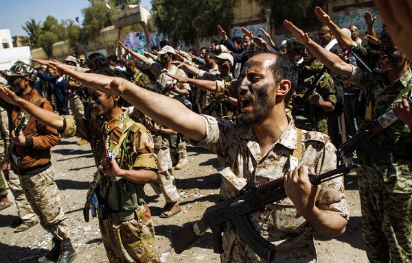 Newly recruited Houthi fighters chant slogans during a gathering in Sanaa on February 2nd, 2017. [Mohammed Huwais/AFP]