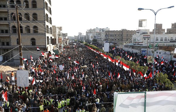 Supporters of Yemen's Houthis attend a December 5th, 2017 rally in Sanaa to celebrate the death of Yemeni ex-president Ali Abdullah Saleh, a day after he was killed. Since Saleh's death, the Iran-backed militia has been ousting his supporters from state agencies in areas under its control. [Mohammed Huwais/AFP]