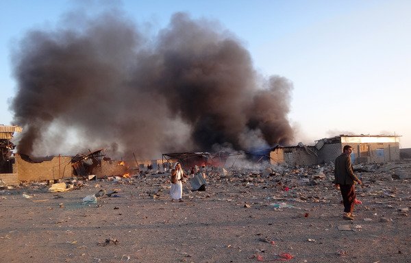Smoke rises as Yemenis inspect the site of airstrikes in the north-western city of Saada, a stronghold of the Houthis, on January 6th. [STRINGER/AFP]