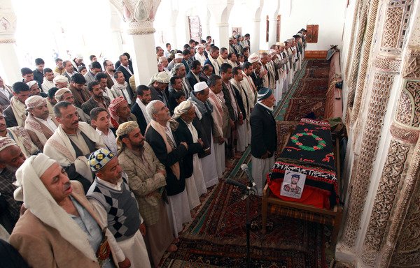 Yemeni mourners attend the August 10th, 2014 funeral in Sanaa of a soldier killed by al-Qaeda in Hadramaut province. Religious scholars in the province met this week to discuss efforts to promote moderate religious discourse and stamp out extremist ideology. [Mohammed Huwais/AFP]