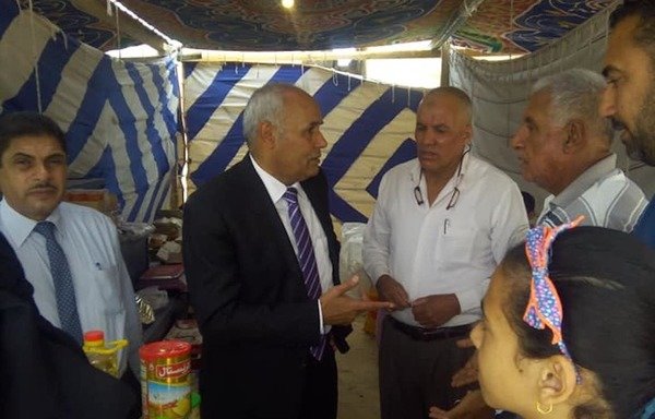 Bir al-Abed Mayor Nasrallah Mohamed Nasrallah officially opens the Ahlan Ramadan food market in North Sinai on May 14th. [Photo courtesy of city of Bir al-Abed media centre]