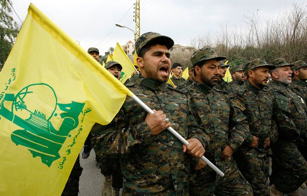 Members of Hizbullah take part in a military parade in a town in southern Lebanon. New sanctions have taken aim at Hizbullah's political leadership. [Photo circulated on social media]