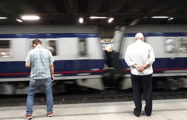 People queue to get on a train at a metro station in Cairo on May 28th. While Egypt's economy is displaying signs of recovery, citizens are facing water, fuel, electricity and metro cost hikes. [Khaled Desouki/AFP]