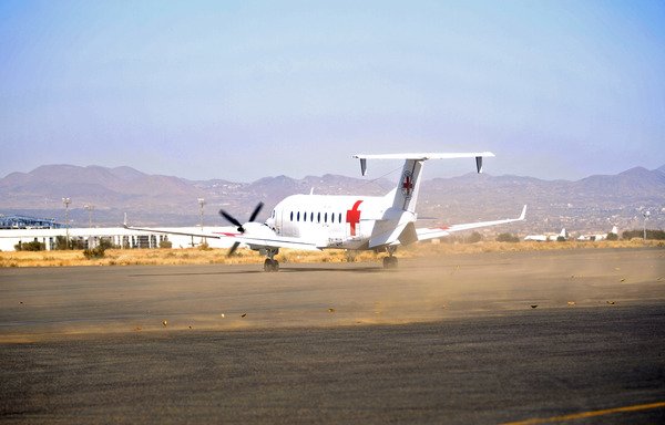 An aircraft of the International Committee of the Red Cross taxis on the tarmac after landing in Houthi-held Sanaa on November 25th. [Mohammed Huwais/AFP]