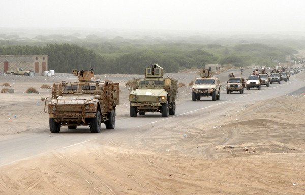 A column of Yemeni pro-government forces and armoured vehicles arrives in al-Durayhimi district, about nine kilometres south of al-Hodeidah international airport, on June 13th.  [Nabil Hassan/AFP]