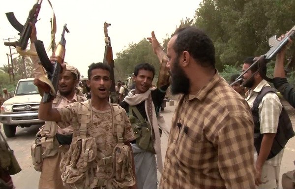 Joint Yemeni forces, backed by the Arab coalition, have reached the vicinity of al-Hodeidah airport on June 15th. This screenshot taken from a video shows them gathering at the south of the airport. [AFP]