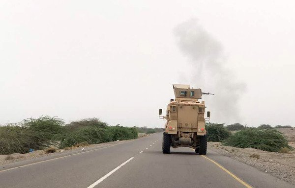 An armoured vehicle fires a heavy machine gun as Yemeni pro-government forces attack Houthi positions in the area of al-Fazah in Yemen's al-Hodeidah province on June 16th. [AFP]