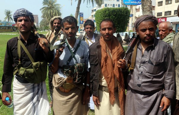 Houthi fighters are seen during a gathering to mobilise more fighters to the battlefront to fight pro-government forces, in the Red Sea port city of al-Hodeida on June 18th. [Abdo Hyder/AFP]