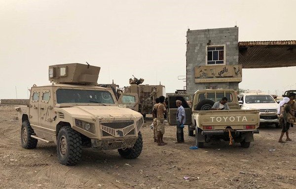 Pro-government forces backed by the Arab coalition are seen during their battle against the Houthis near al-Hodeidah airport on June 19th. [Stringer/AFP]