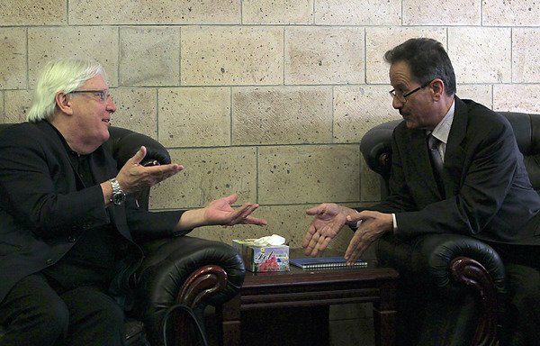 The UN special envoy for Yemen Martin Griffiths meets with the undersecretary of the Houthis' foreign ministry, Faisal Amin Abu-Rass, at the Sanaa international airport on July 2nd. [Mohammed Huwais/AFP]