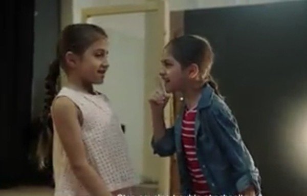 Children play the role of parents in a still from a video launched by UNICEF as part of the campaign. [Nohad Topalian/Al-Mashareq]