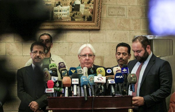 UN special envoy for Yemen Martin Griffiths gives a press conference at Sanaa's international airport prior to his departure on July 4th, accompanied by Faisal Amin Abu-Rass, the under-secretary of the Houthis' foreign ministry. [Mohammed Huwais/AFP]
