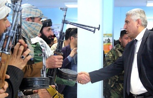 Herat Provincial Governor Mohammad Asif Rahimi greets former Taliban insurgents February 21st in Herat city after they refused to carry out orders from Iran to attack a Turkmenistan-Afghanistan-Pakistan-India (TAPI) natural gas pipeline ceremony. [Sulaiman]