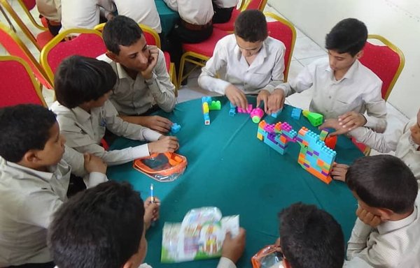 Houthi-recruited child soldiers undergoing rehabilitation in Yemen engage in a LEGO activity as part of a rehabilitation programme, sponsored by KSRelief, which aims to provide them with psychological relief and put them on the path of social reintegration. [Photo courtesy of the child soldiers rehabilitation programme]