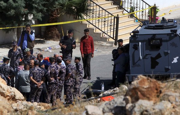 Jordanian forces gather during a raid in Salt on Sunday (August 12th). They killed three and arrested five others during the raid, in which four members of the security forces also died. [Khalil Mazraawi/AFP] 