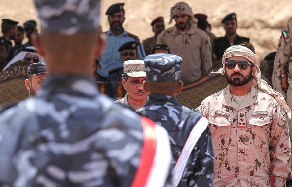 A picture taken August 8th during a trip organised by the UAE's National Media Council shows Emirati Brig. Gen. Ali Saif Al Kaabi, commander of the Saudi and UAE coalition forces in Yemen, attending the graduation of UAE-trained police cadets in the Yemeni port city of al-Mukalla, in the first such ceremony after the city was retaken from al-Qaeda. [Karim Sahib/AFP]
