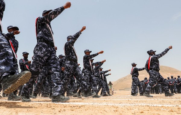 A picture taken August 8th shows UAE-trained cadets of the Yemeni police marching during their graduation in the Hadramaut provincial capital of al-Mukalla. [Karim Sahib/AFP] 