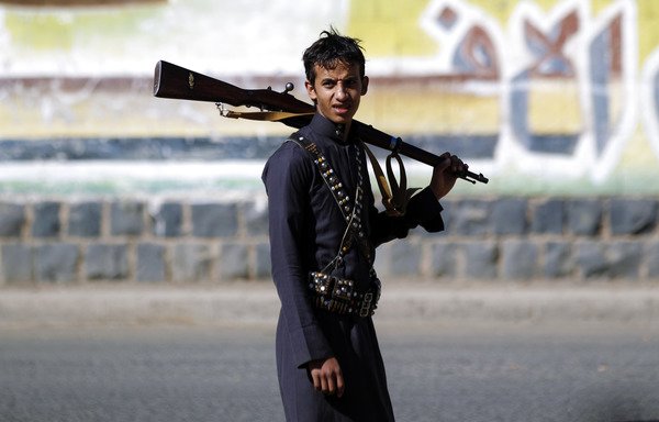 A Houthi fighter carries a rifle during a gathering in Sanaa to mobilise more fighters to battlefronts on February 2nd, 2017. [Mohammed Huwais/AFP]