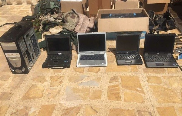 Iraqi forces display computers and communication equipment found at an 'Islamic State of Iraq and Syria' hideout in Mosul. [Photo courtesy of the National Security Agency]