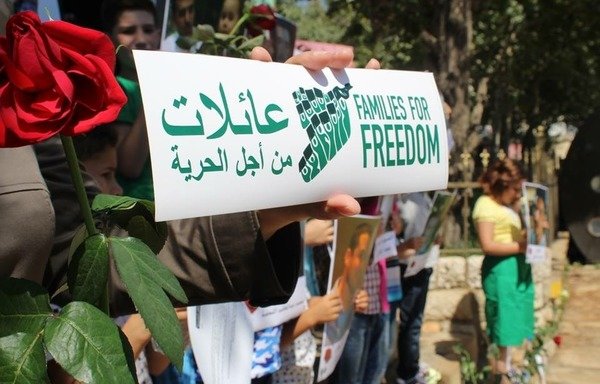 Syrian families in Lebanon take part in a recent protest, organised by Families for Freedom, to call for the release of their forcibly disappeared family members in Syria. [Photo courtesy of Families for Freedom]