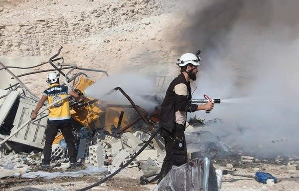 Syria Civil Defense elements try to extinguish a fire that broke out in a house as a result of the airstrikes on Idlib by Russian and regime warplanes. [Photo courtesy of Syria Civil Defence]