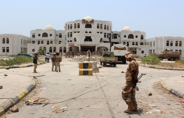 Yemeni forces walk in Zinjibar on August 16th, 2016 after they entered the Abyan provincial capital following an offensive backed by the Arab coalition to recapture the city from al-Qaeda. [Saleh al-Obeidi/AFP]