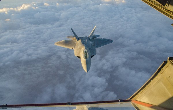 A US Air Force F-22 Raptor from the 94th Expeditionary Fighter Squadron at al-Dhafra Air Base in the UAE, flies over southwest Asia, September 12th. The F-22 performs both air-to-air and air-to-ground missions in order to defeat threats to the US and their partners in the region. The US has threatened to respond if the Syrian regime uses chemical weapons in its offensive on Idlib. [Staff Sgt. Ross A. Whitley/US Air Forces Central Command]