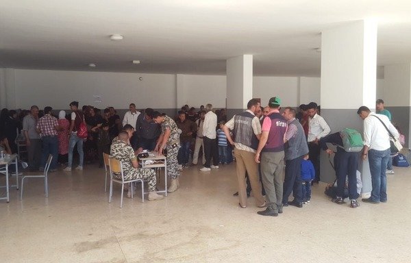 Syrian refugees register their names and other information required for their repatriation at the Bourj Hammoud General Directorate of General Security office. [Photo courtesy of GDGS] 