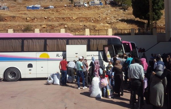 Syrian refugees who had been sheltering in Lebanon return to their homeland. [Photo courtesy of GDGS]