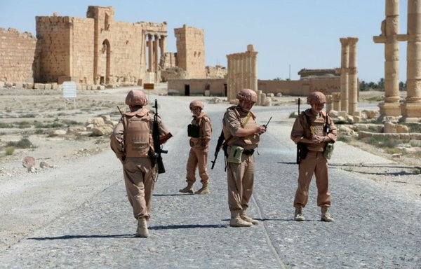 Russian soldiers are seen inside the ancient Syrian city of Palmyra (Tadmor). [Vasily Maximov/AFP]