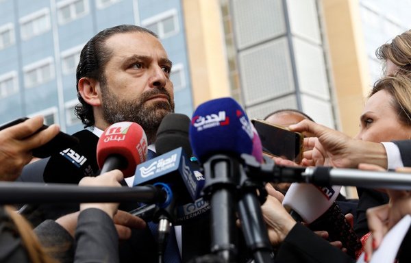 Lebanese premier-designate Saad al-Hariri speaks to the press on September 10th, in front of the Special Tribunal for Lebanon in The Hague after the presentation of the closing arguments in the trial of four Hizbullah suspects accused of the 2005 assassination of his father, Rafiq. [Bas Czerwinski/ANP/AFP]