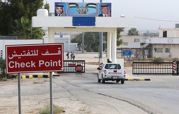 A vehicle arrives at the Nassib-Jaber border crossing between Jordan and Syria on October 15th, the day of its reopening, in Jordan's Mafraq governorate. [Khalil Mazraawi/AFP]