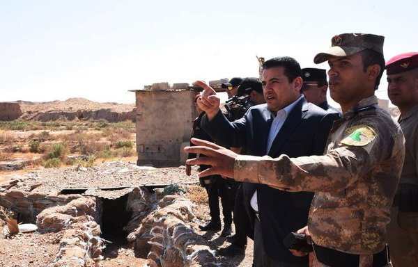 Iraqi Interior Minister Qassim al-Araji visits border towns in western Iraq in late September to oversee preparations to thwart the flow of 'Islamic State of Iraq and Syria' fighters from Syria. [Photo courtesy of the Border Guard Command]