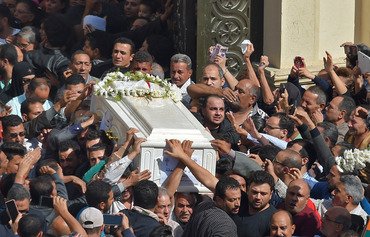 Angry Copts mourn Egypt bus attack victims