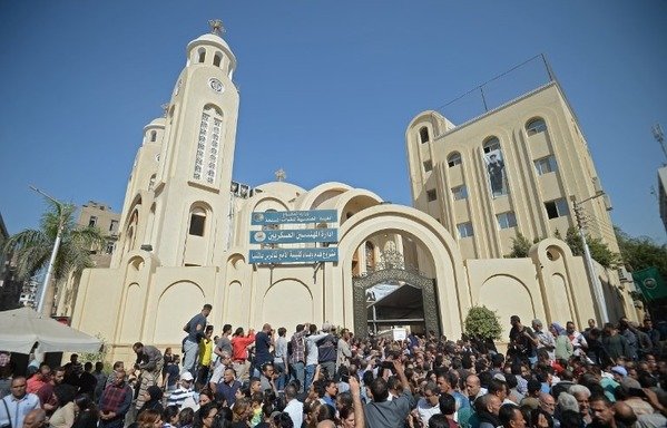 Crowds gather on November 3rd as Coptic Christians carry the coffins of victims killed in an attack a day earlier, following a morning ceremony at the Prince Tadros church in Egypt's southern Minya province. [Mohammed al-Shahed/AFP]