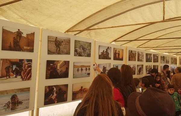 A photo exhibit was held in Kobani November 1st on the occasion of the International Day of Solidarity with Kobani, to celebrate the city's resistance against ISIS. [Photo courtesy of Saleh Mohammed]