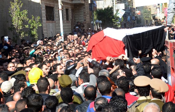 Egyptian men carry the coffin of Col. Mohammed Adel, who was killed in a roadside bombing claimed by ISIS, during his funeral ceremony on the outskirts of the North Sinai provincial capital of al-Arish on January 29th, 2016. [STRINGER/AFP]
