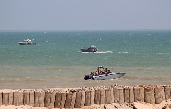 Yemeni pro-government forces are seen in military boats in the Hadramaut province port of al-Mukalla on November 29th. [Saleh al-Obeidi/AFP] 