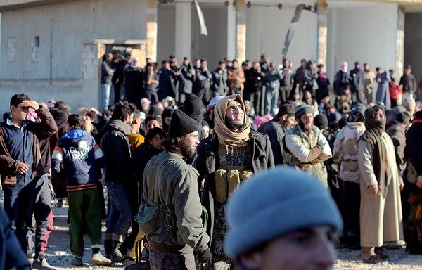 This archive photo, from an earlier gathering of ISIS elements in Deir Ezzor province, clearly shows the good quality with which the group's propaganda material used to be produced. After ISIS's decline, media releases are not only rare, but also of poor quality. [Photo courtesy of Mazen Zaki]