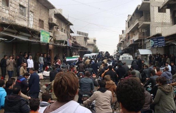 Activists in the Syrian city of Azzaz in northern Aleppo protest the abuses committed by Tahrir al-Sham. [Photo courtesy of Haisam al-Idlibi]
