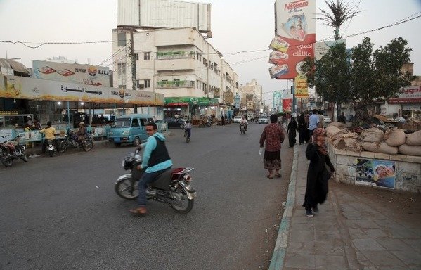 A picture taken on December 17th shows people driving in a market in the Yemeni city of al-Hodeidah. [AFP]