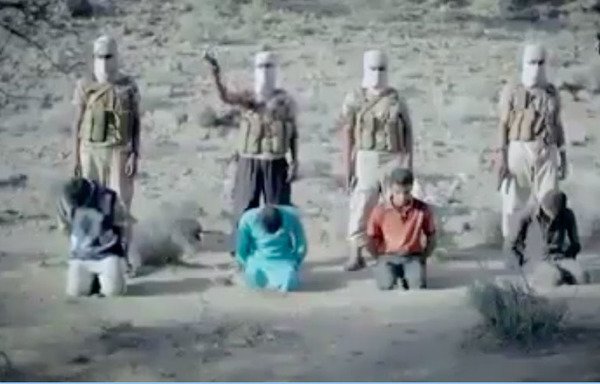 A screenshot from a video widely circulated online shows four masked ISIS gunmen moments before they executed four youths at an undisclosed location in Yemen's al-Bayda province.