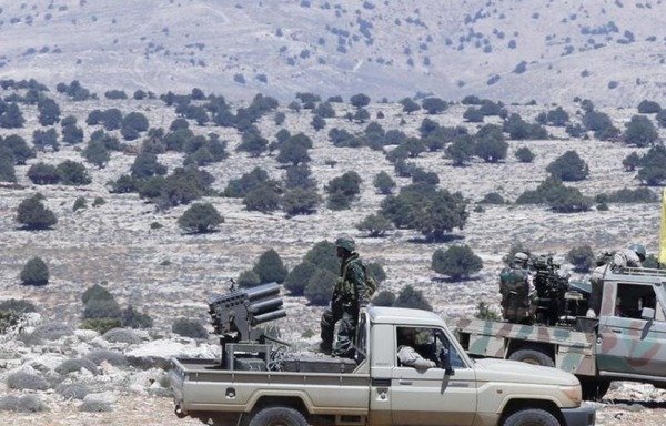 Fighters from Lebanon's Hizbullah patrol Syria's Qalamoun region. [Photo circulated on social media]