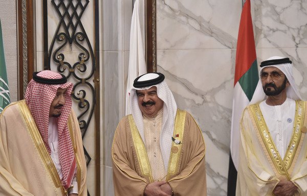 Saudi Arabia's King Salman bin Abdulaziz, Bahrain's King Hamad al-Khalifa and Vice President and Prime Minister of the UAE Sheikh Mohammed bin Rashid Al Maktoum pose for a picture at the Diriya Palace in Riyadh during the Gulf Co-operation Council summit on December 9th. [Fayez Nureldine/AFP]
