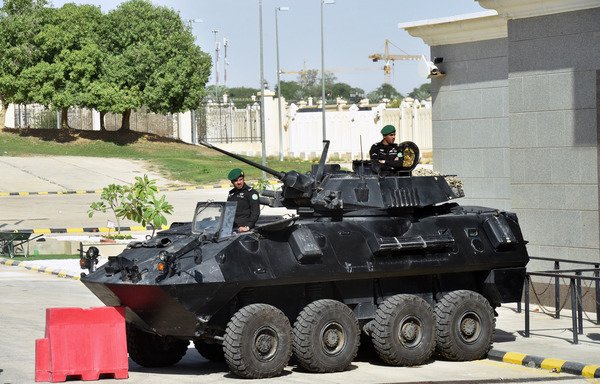 Saudi soldiers in armoured vehicles guard the entrance to the Diriya Palace in Riyadh during the Gulf Co-operation Council summit on December 9th. [Fayez Nureldine/AFP]