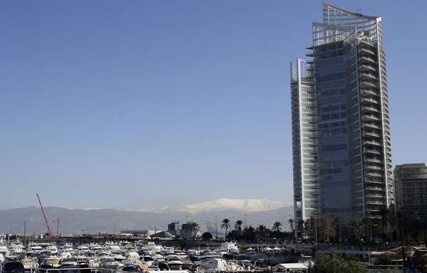 A skyscraper rises in Beirut's Zeituni Bay, in a photo taken January 23rd. Lebanon is taking steps to protect its citizens and its public and private sector institutions from cybercrime. [Joseph Eid/AFP]