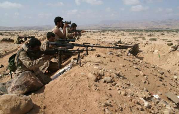 In this file photo, Yemeni soldiers take position behind a trench during an offensive against al-Qaeda extremists in the southern province of Shabwa, on May 7th, 2014. [AFP] 