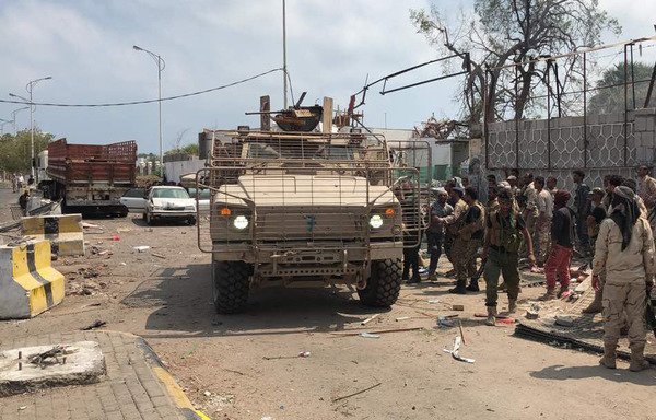 Yemeni men and security forces inspect the site of a suicide bombing carried out by al-Qaeda in the southern port city of Aden, on November 5th, 2017. [Stringer/AFP]